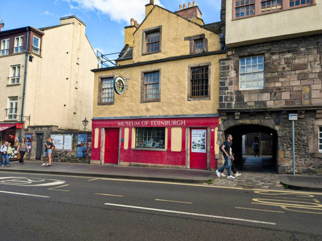 View of the vibrant exterior of the Huntly House and the Museum of Edinburgh from across the street