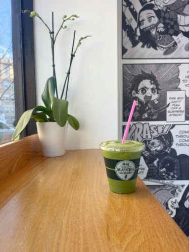 An iced matcha latte by the window at Matcha Cafe Maiko