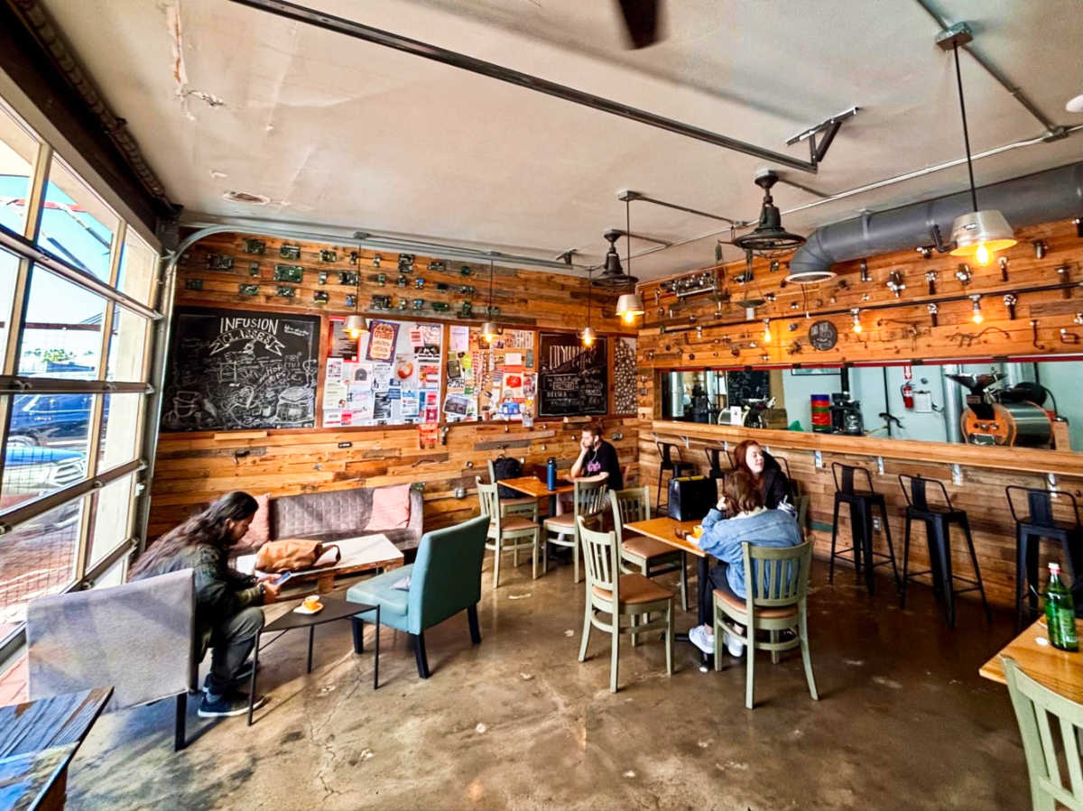 People inside the cozy interior of Infusion Coffee & Tea Crafters
