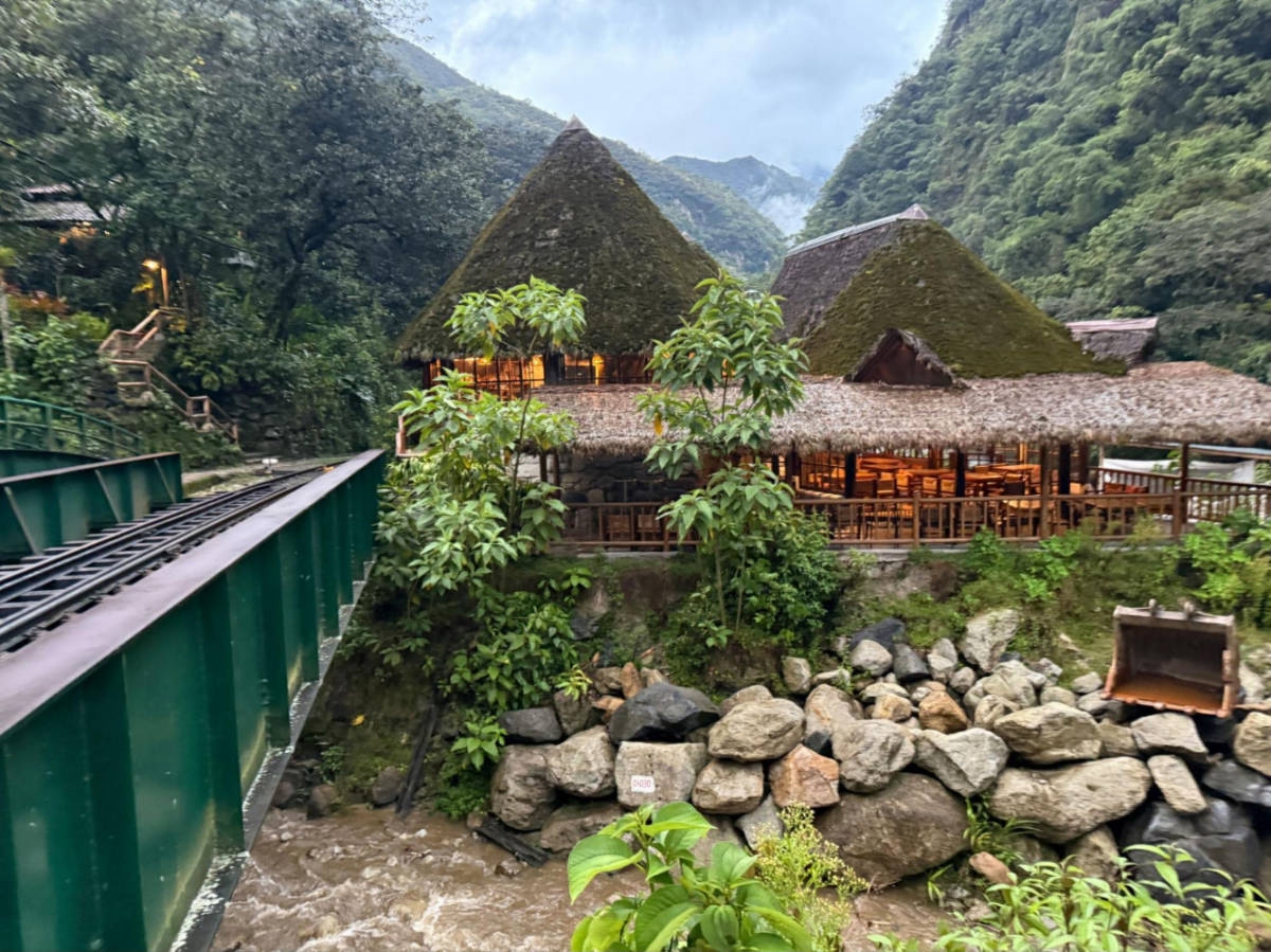 View of the exterior of Inkaterra Machu Picchu Pueblo Hotel surrounded by greenery