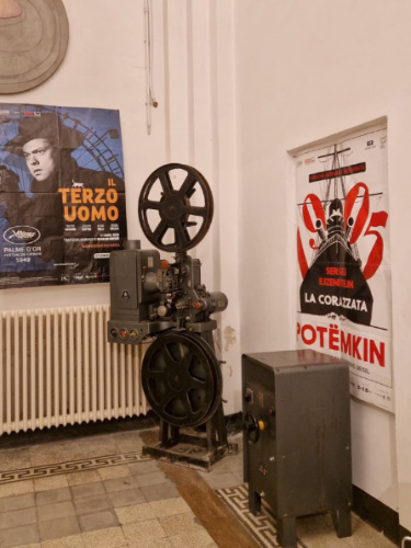 View of the vintage equipment and movie posters inside Nuovo Cinema Pendola