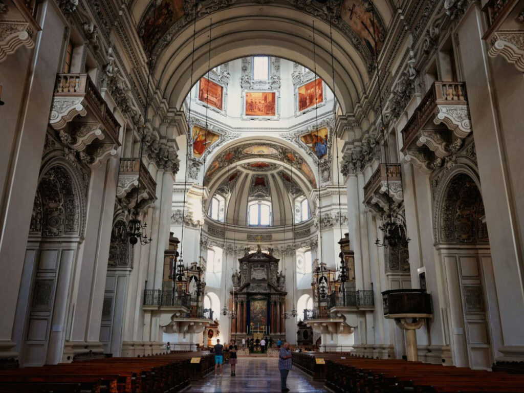 View of the intricate interior and stained glass of the Salzburg Cathedral