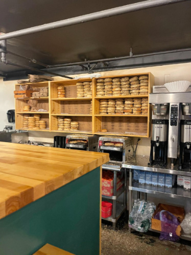 Fresh bagels displayed inside the Black Sheep Bagel Cafe