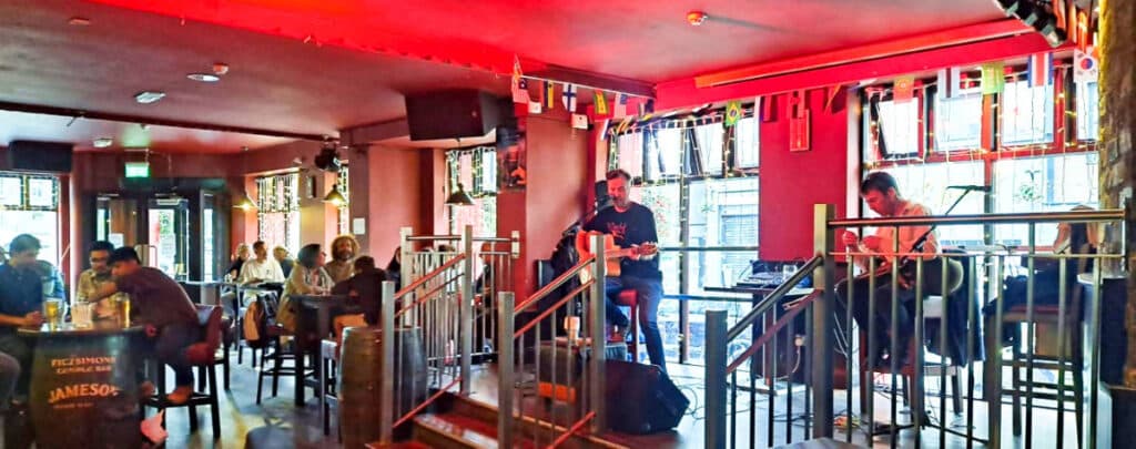 View of the Irish musicians performing inside the pub in Dublin