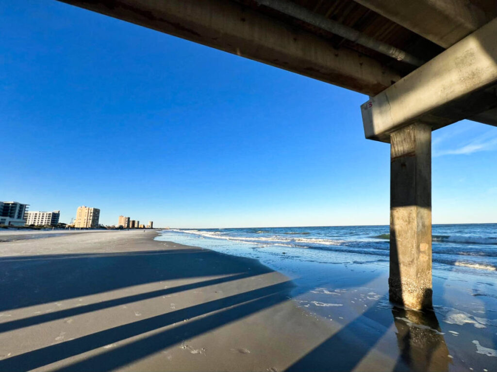 View of the Jacksonville Beach skyline from the bottom of the pier