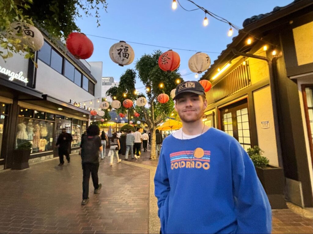 Michael beneath the lanterns in the Japanese Village Plaza