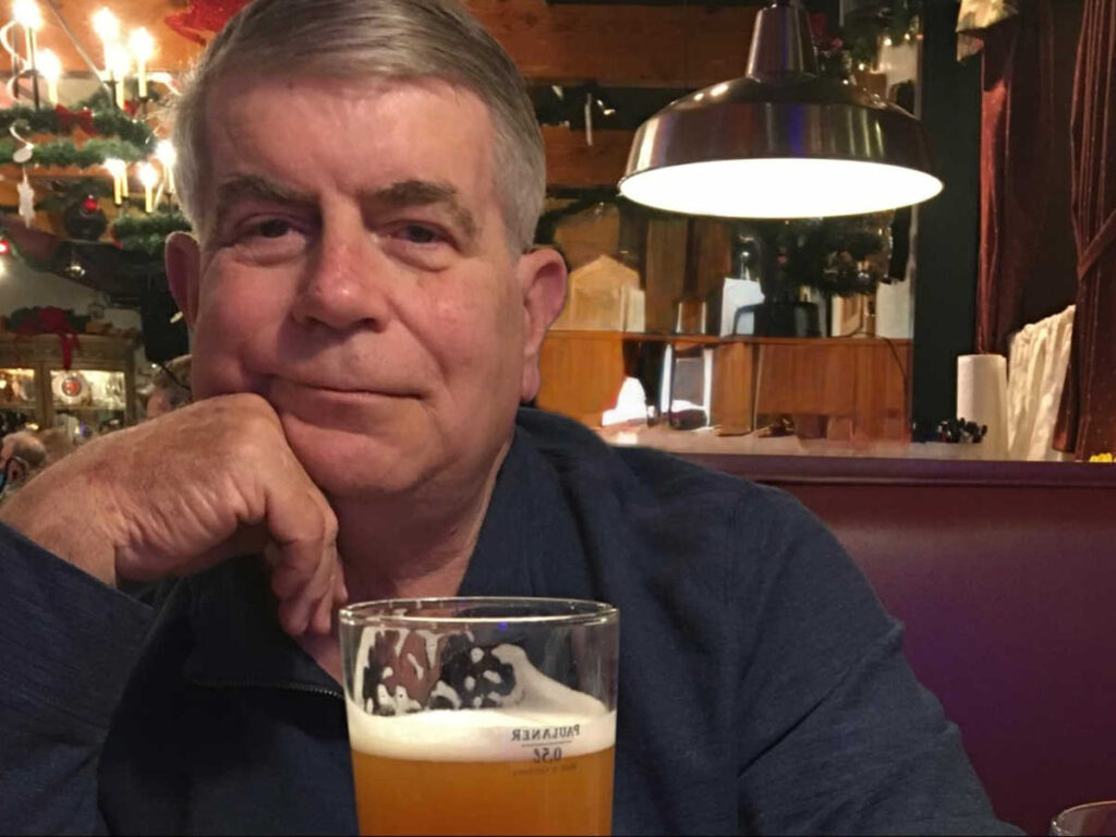 The author's husband, Jeff with a glass of beer at the Ole Smoky Distillery & Yee-Haw Brewing Co.
