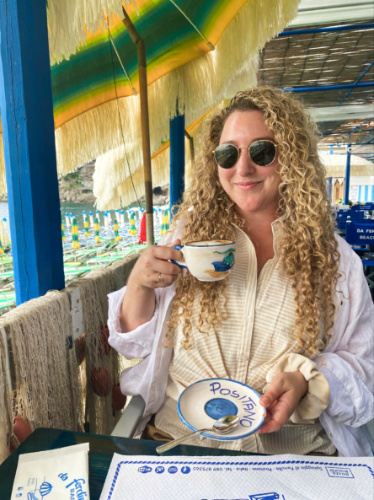 The author Jess Levy drinking a cup of coffee