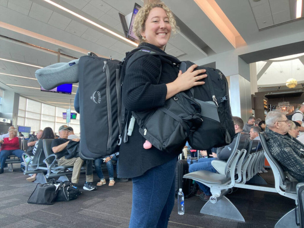 The author Jess Levy carrying all her travel bags