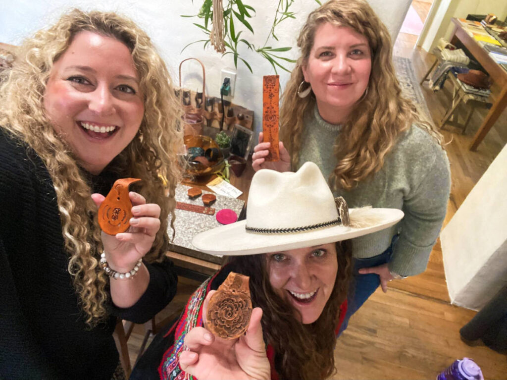 The author Jess Levy and her friends showing their leatherware inside a local artist’s studio