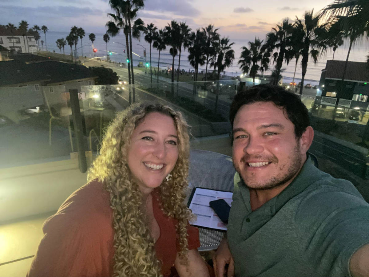 Travel Lemming author Jess and her date takes a selfie at the Tower39 Rooftop Lounge at sunset
