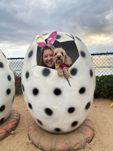 The author Jess Levy and her Dog on the dinosaur egg exhibit