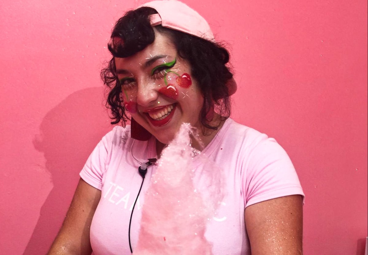 Travel Lemming Writer, Jess with cute cherry face painting posing holding a cotton candy