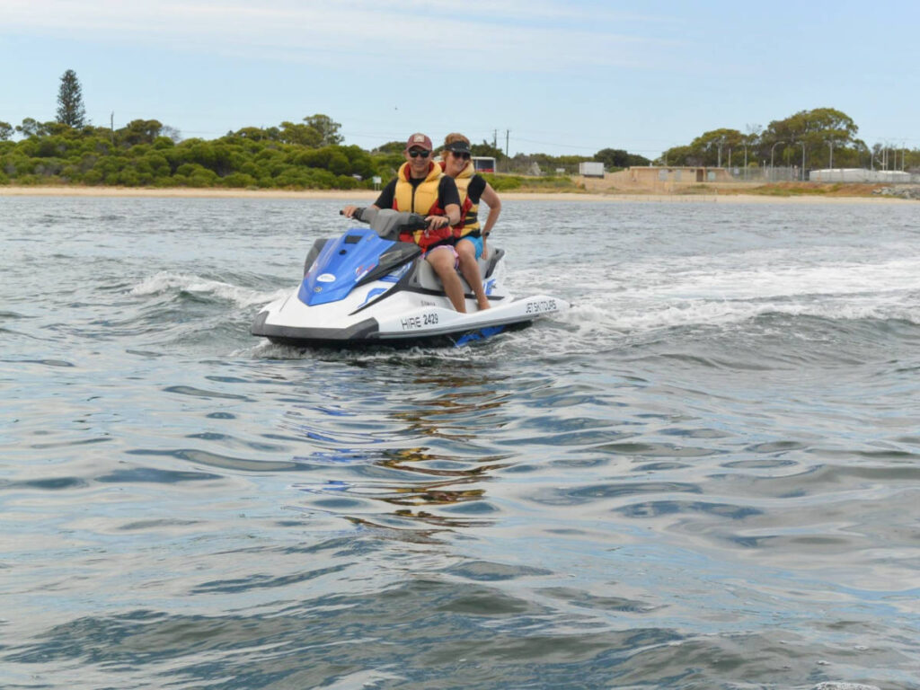 The author Lisa Ikin and her partner, enjoying the jet ski ride in Rockingham