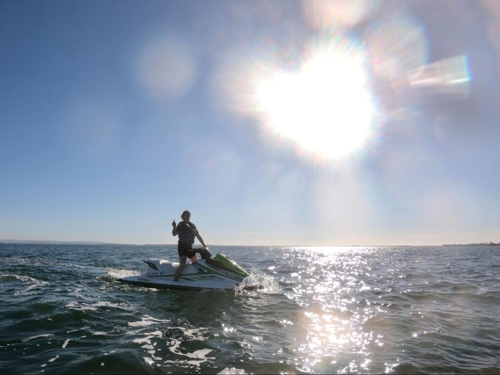 Author Betty jet skiing by the Coronado Bridge