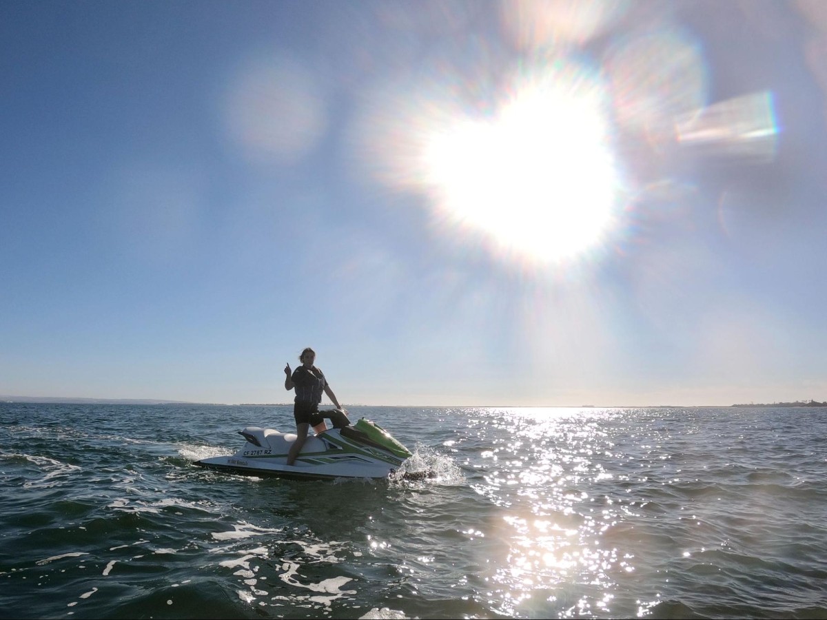 Author Betty jet skiing by the Coronado Bridge