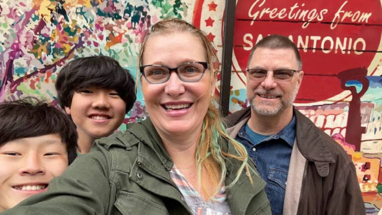 The author Jill Robbins and her family, smiling for a photo in San Antonio