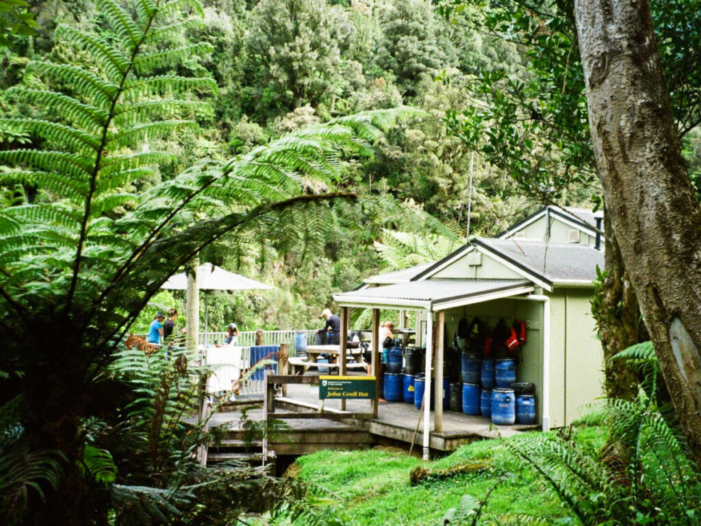 View of the John Coull Hut surrounded by greenery