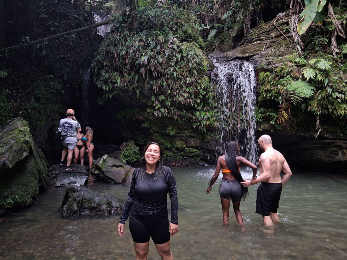 Author Vanessa and other tourists visiting the Juan Diego waterfall in El Yunque