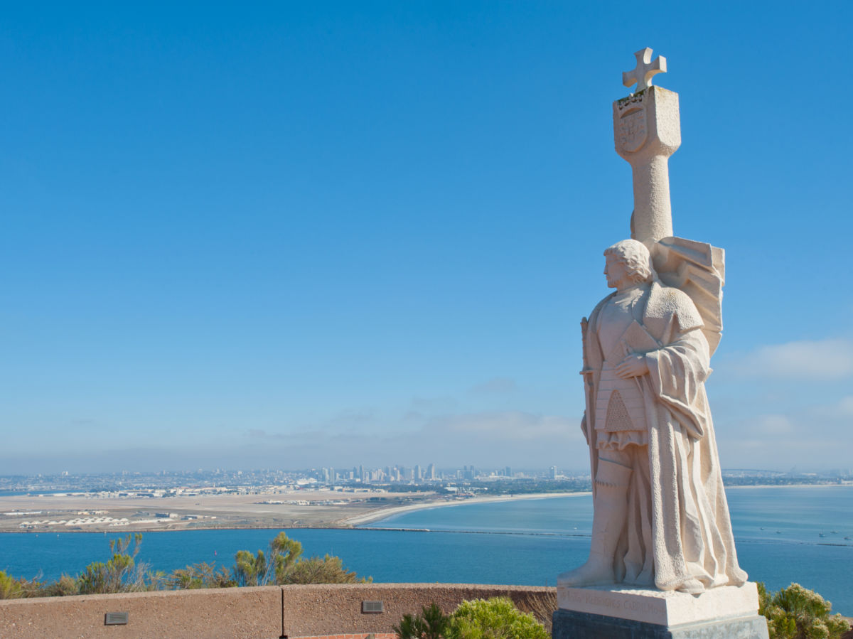 The Juan Rodri­guez Cabrillo statue at Loma Point and panorama view of San Diego