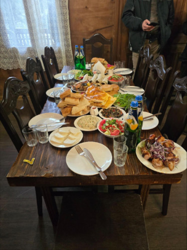 A table covered with foods and wine for a Kakhetian Supra