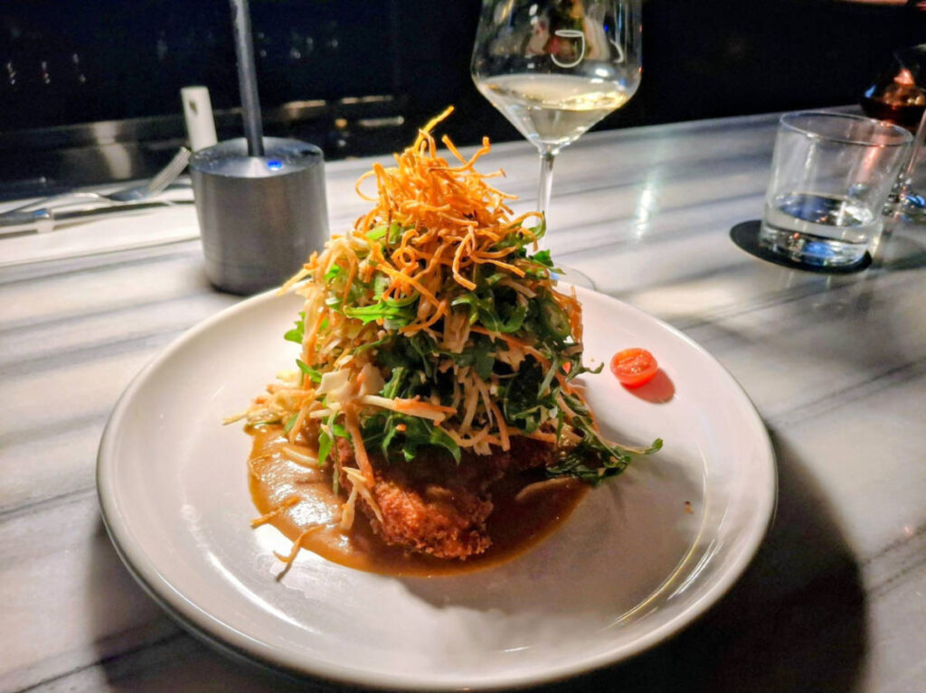 Closeup look of a plate of Katsu Chicken Salad from JOEY