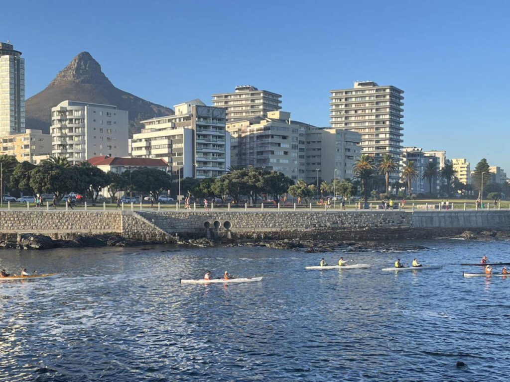 People kayaking in Granger Bay with skyline views