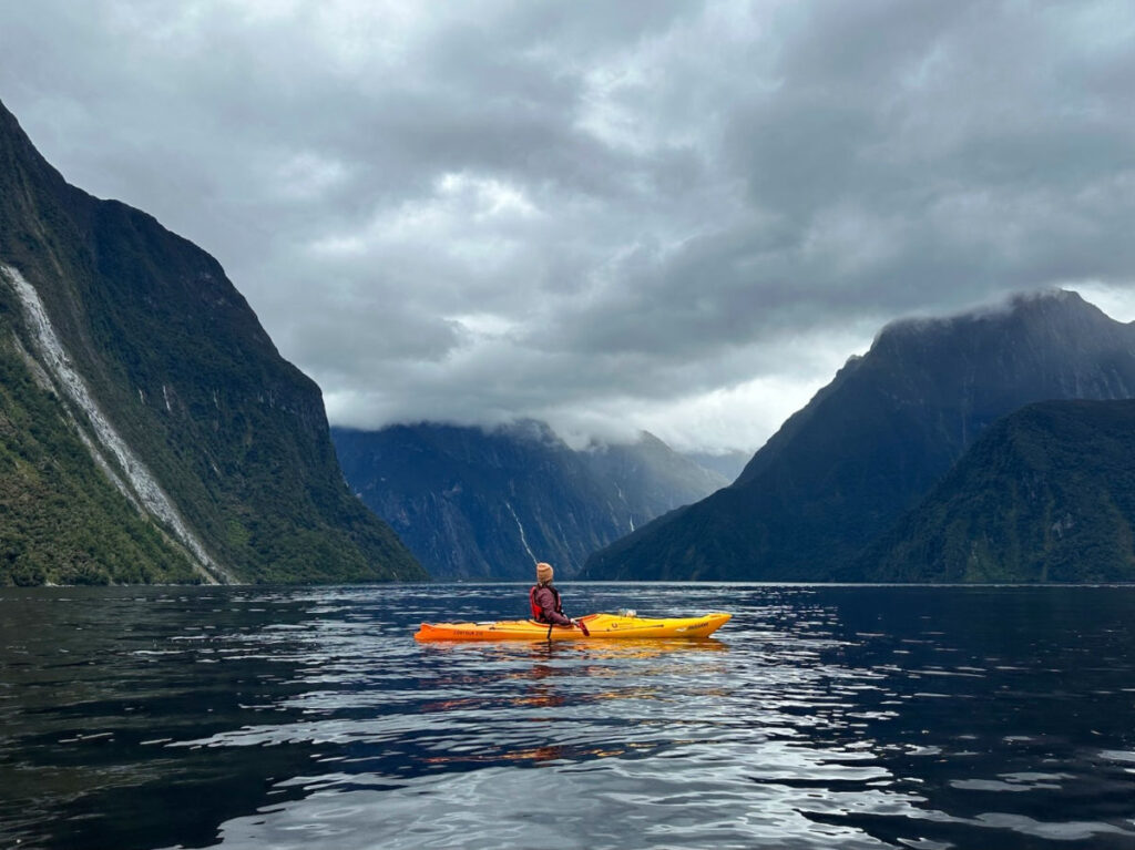 A person kayaking in Milford Sound