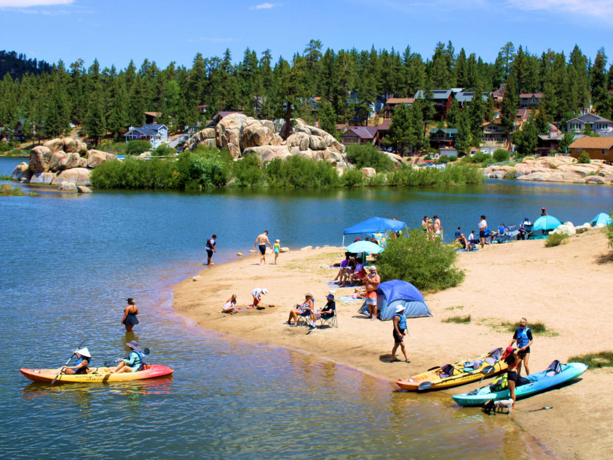 People kayaking and swimming in the Big Bear Lake
