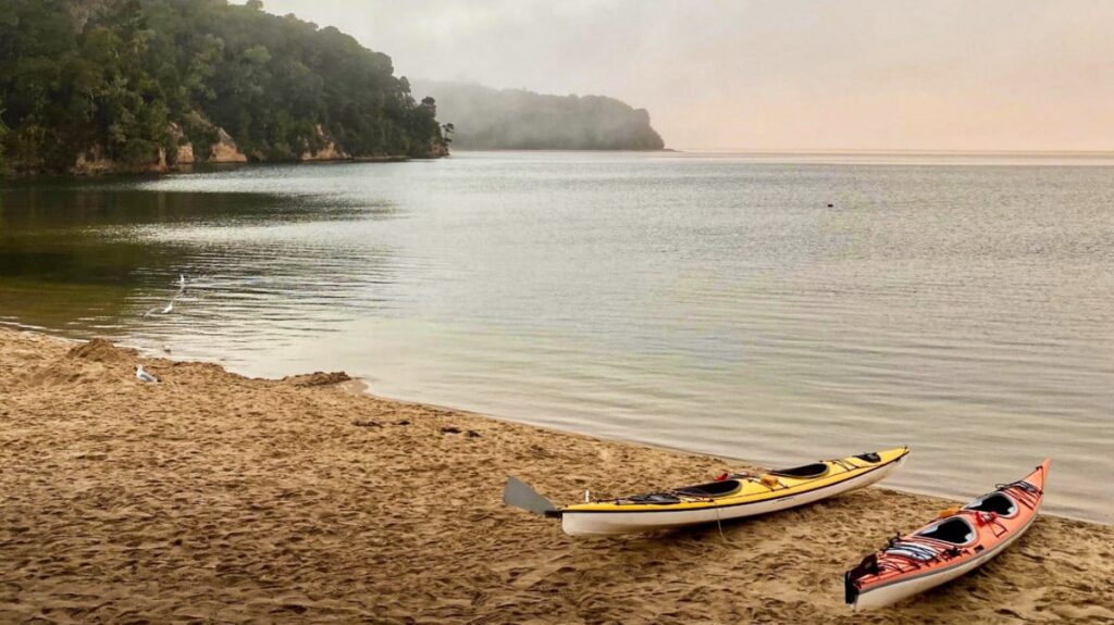 Two kayaks on the shore in Tomales Bay