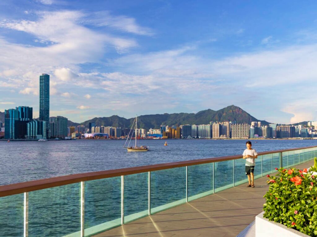 A man walking along the Kennedy Town Waterfront