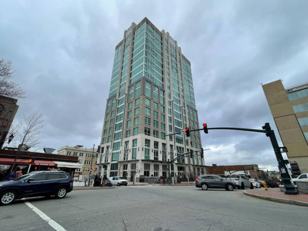 View of the building of Kimpton – Hotel Arras from across the street in downtown Asheville