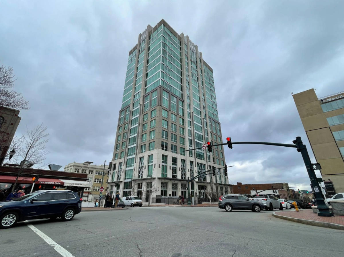View of the building of Kimpton – Hotel Arras from across the street in downtown Asheville