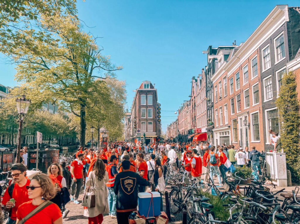 Crowd of people wearing orange shirts for the King’s Day