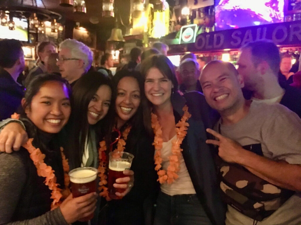 Travel Lemming writer Betty and friends having fun on King’s Day in Amsterdam