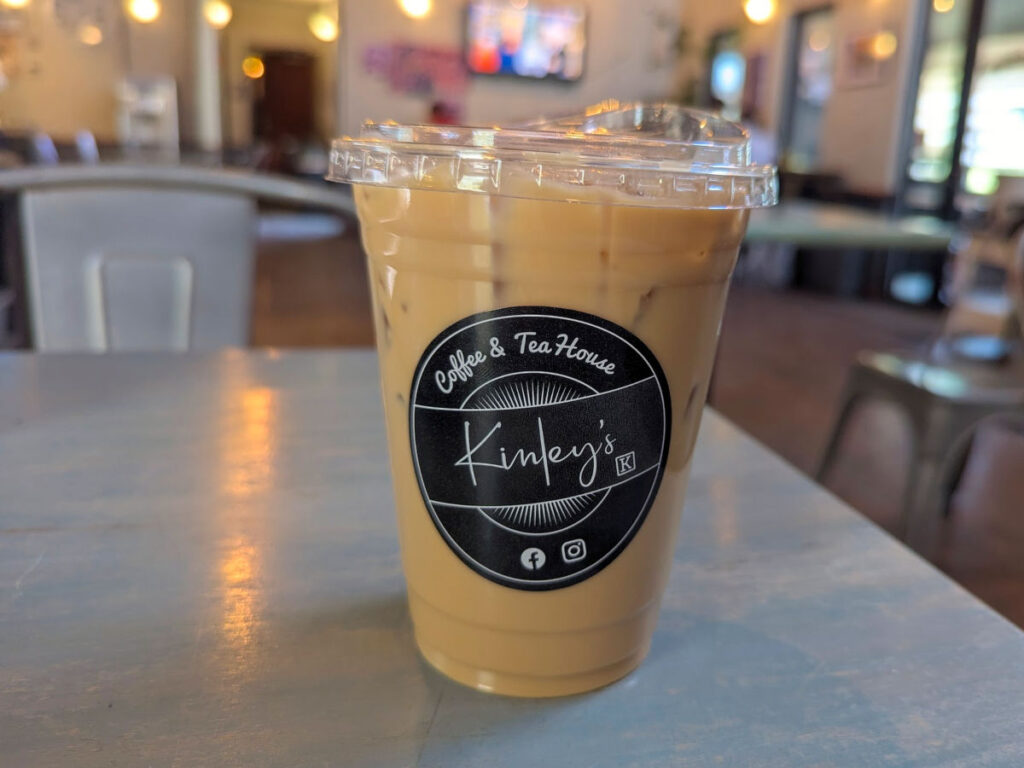 Kinley’s iced latte served in a plastic cup