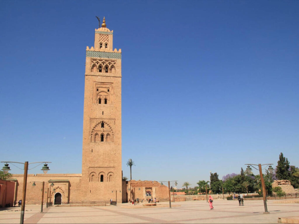 The tall tower of Koutoubia Mosque against a clear blue sky