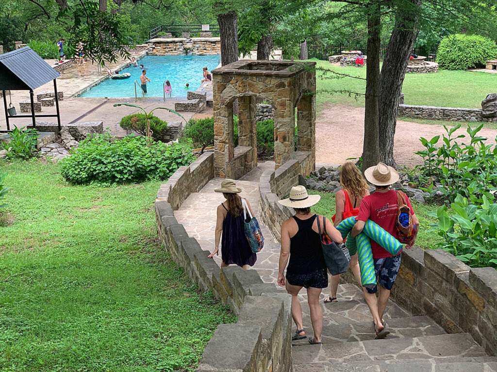People going down to the swimming pool at Krause Springs