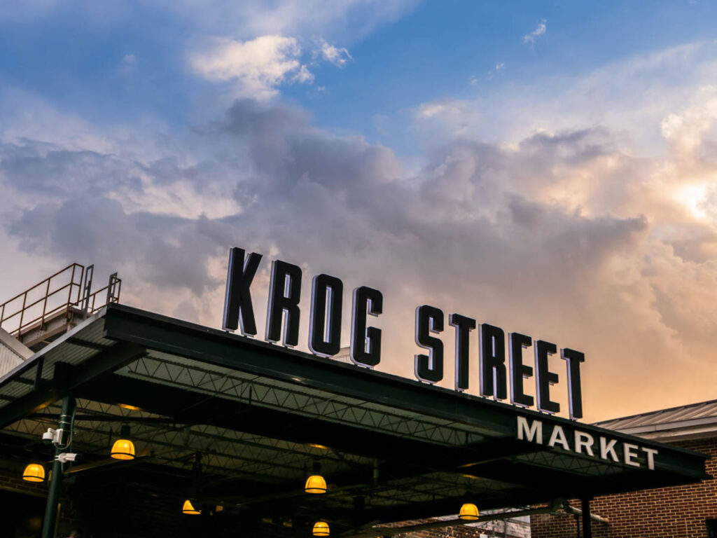View of the Krog Street Market sign under the blue sky at dusk