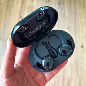 A hand holding the Kuizil Bluetooth Earbuds