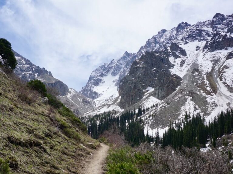 The hiking trail surrounded by mountain ranges in Kyrgyzstan