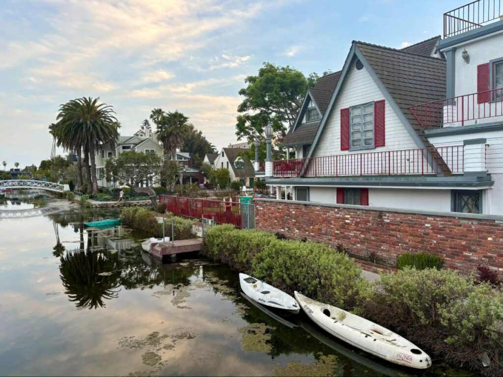 Houses and boats docked in the Venice Canals in LA