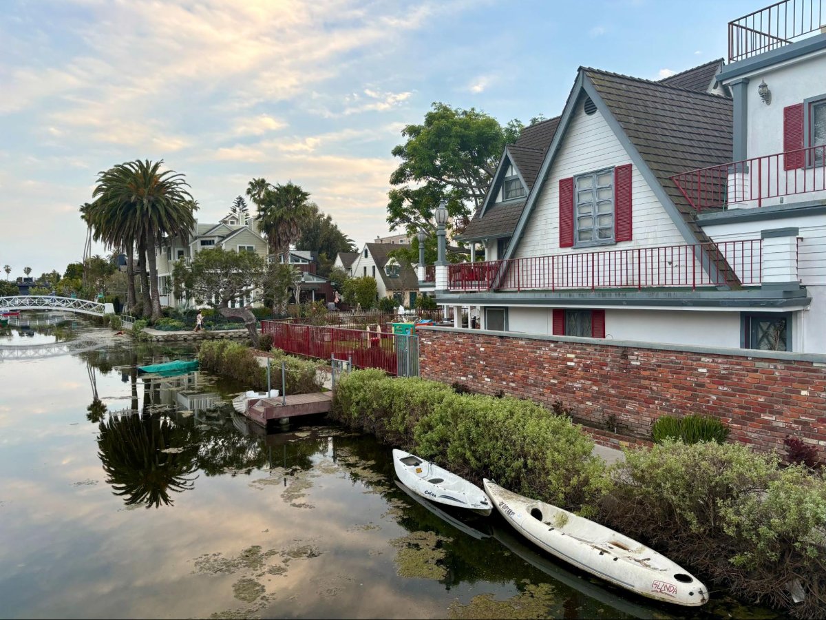 Houses and boats docked in the Venice Canals in LA