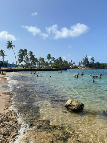 People swimming at La Pecera in Escambrón Beach
