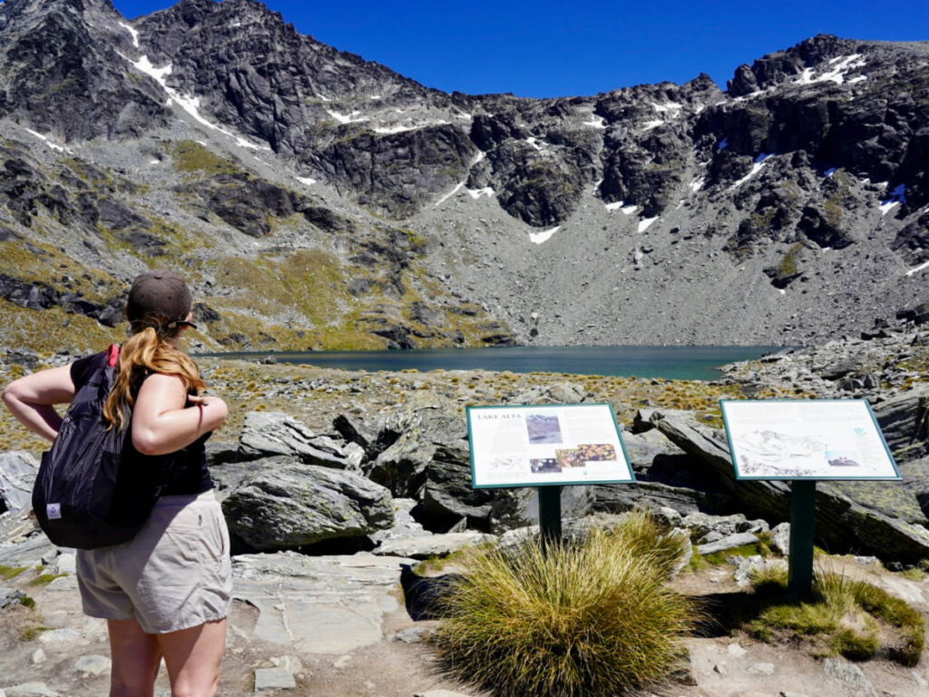 A woman looking at Lake Alta from a faraway view