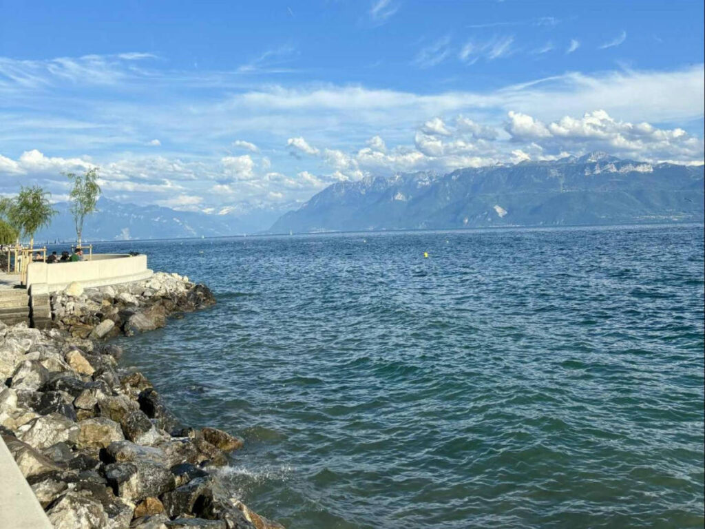 People enjoying the scenic view along Lake Geneva