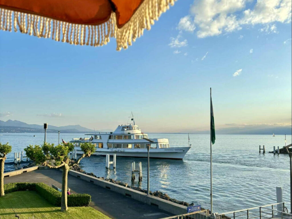 Overlooking view of the boat on Lake Geneva at sunset from the rooftop