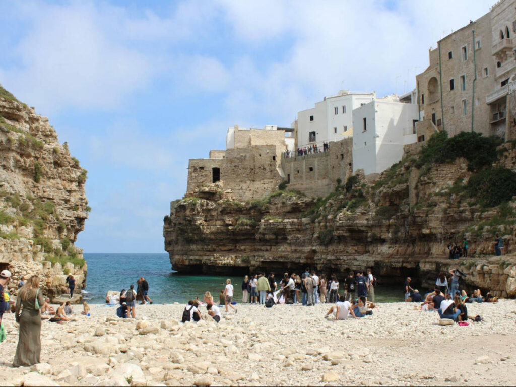People enjoying at the Lama Monachile beach