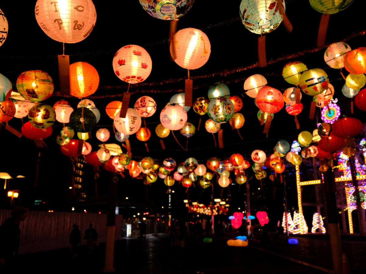 Paper lanterns lit up at night on a street in Xinyi