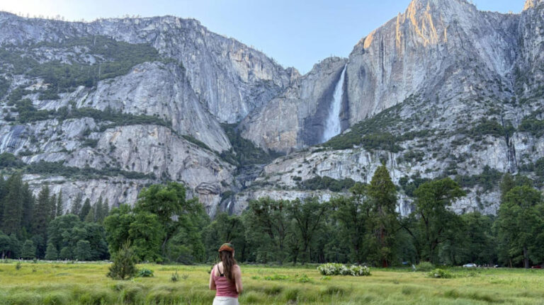The author Laura McFarland, admiring Upper Yosemite Falls in Cook’s Meadow